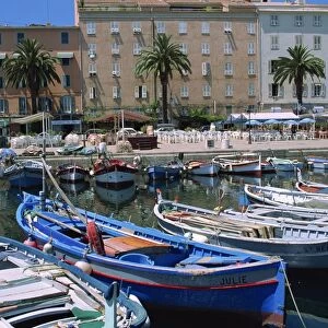 Fishing boats moored in the harbour and waterfront at Ajaccio, island of Corsica