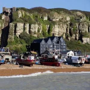 Fishing fleet drawn up on beach and East Hill lift, Hastings, Sussex, England, United Kingdom, Europe