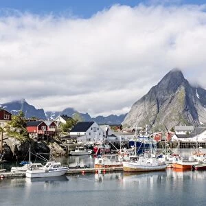 Fishing village and harbour framed by peaks and sea, Hamnoy, Moskenes, Nordland county