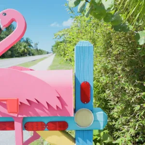 Flamingo made of wood attached to pink mailbox, Sanibel Island, Florida