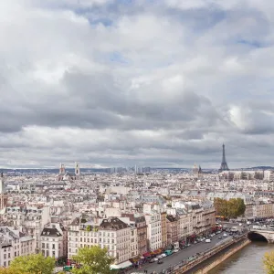 A gargoyle on Notre Dame de Paris cathedral keeping a watchful eye over the city below, Paris, France, Europe