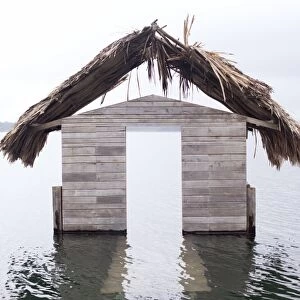 High water floods lakeside cabanas, Climate Change, Lago Peten Itza, Guatemala, Central America
