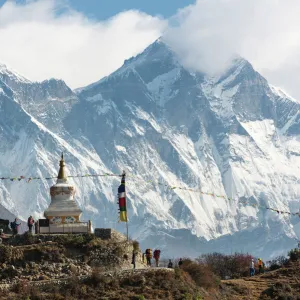 Hoards of trekkers make their way to Everest Base Camp, Mount Everest is the peak on the left