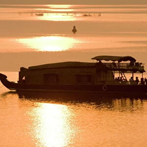 Houseboat at dusk in Ashtamudi Lake, Kollam, Kerala, India, Asia