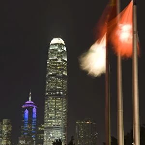 Two IFC Building and Hong Kong flags at night, Hong Kong, China, Asia