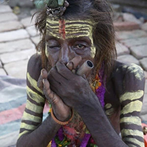 Indian sadhu smoking a chilum in Vrindavan, Uttar Pradesh, India, Asia