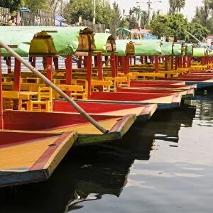 Line of colourful boats at the Floating Gardens in Xochimilco, UNESCO World Heritage Site, Mexico City, Mexico, North America