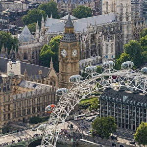 The London Eye and Jubilee Gardens with the Houses of Parliament in the distance, London