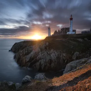 Long exposure panorama of a sunset with coloured clouds at Saint Mathieu Lighthouse, Finistere, Brittany, France, Europe