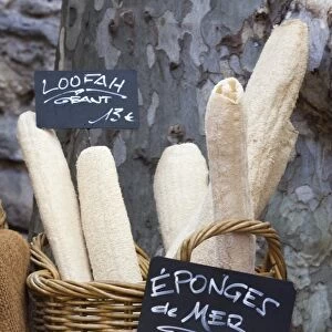 Loofahs and sponges shaped like baguettes and bread in the Saturday market, Ceret, France, Europe