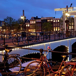 Magere Brug (Skinny Bridge) at dusk, Amsterdam, Holland, Europe