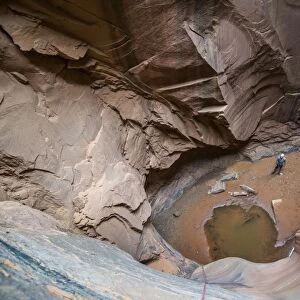 Man standing in a slot canyon after canyoneering, Moab, Utah, United States of America, North America