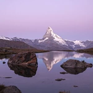 The Matterhorn reflected in the Stellisee at dusk, Zermatt, Canton of Valais, Pennine Alps