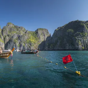 Maya Bay The Beach with long-tail boats and tourists, Phi Phi Lay Island, Krabi Province