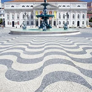 Mosaics and fountain with Lisbon Opera House in the background