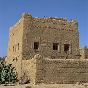 Mud built fortress house with decorated windows