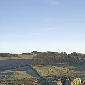 North gateway to Housesteads Roman Fort, stone water storage tank in foreground