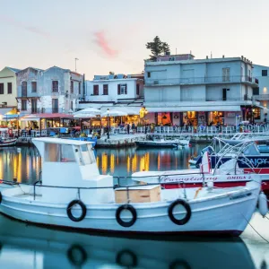 Old Venetian harbour, taverns on seaside at dusk, Rethymno (Rethymnon), Crete, Greek Islands