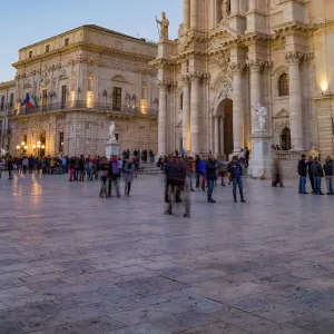 People enjoying passeggiata in Piazza Duomo on the tiny island of Ortygia, UNESCO