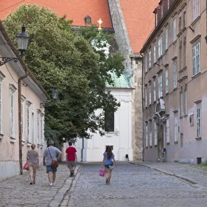 People walking along Kapitulska Street in Old Town, Bratislava, Slovakia, Europe