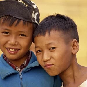 Portrait of two boys of the Akha hill tribe in western