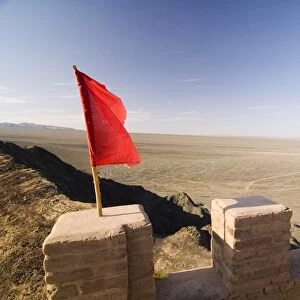 Red Flag flying on overhanging great wall, UNESCO World Heritage Site, Jiayuguan