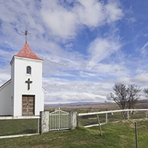 Red roofed Lutheran Icelandic church at Sidimuli