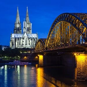 Rhine bridge and Cathedral of Cologne above the River Rhine at night, Cologne, North Rhine-Westphalia, Germany, Europe