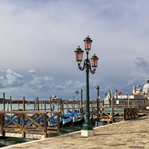 The Riva degli Schiavoni with typical green street lamps and gondola moorings, Venice, UNESCO World Heritage Site, Veneto, Italy, Europe