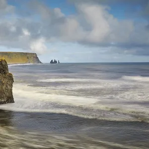 A rocky Atlantic shoreline on Dyrholaey Island, looking towards Reynisfjara beach, near Vik, south coast of Iceland, Polar Regions