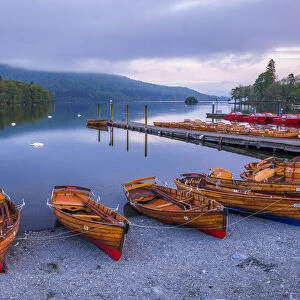 Rowing boats at Windermere at sunset, Lake District National Park, UNESCO World Heritage Site
