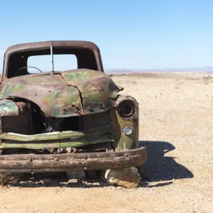 A rusty abandoned car in the desert near Aus in southern Namibia, Africa