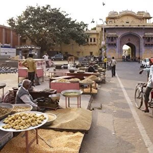 Sellers of pigeon food outside gates of City Palace, Jaipur, Rajasthan, India, Asia