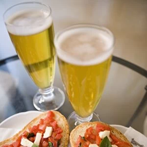 Snack of beer and bruschetta in cafe