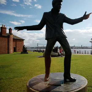 The statue of Billy Fury by Albert Dock and the Mersey River, Liverpool