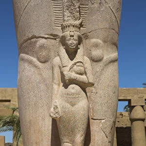 Statue of Nefetari, at base of statue of Ramses II, Great Court, Karnak Temple Complex