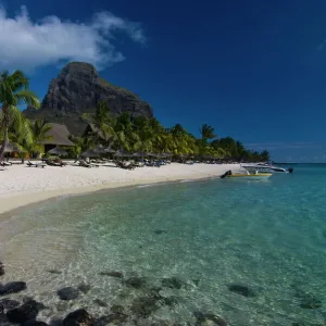 Sun loungers on the beach and Mont Brabant (Le Morne Brabant), UNESCO World Heritage Site