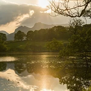 Sunset at Loughrigg Tarn near Ambleside, Lake District National Park, Cumbria, England