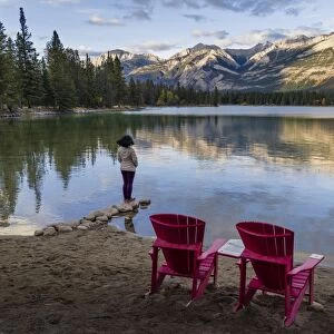 Tourist and Red Chairs by Lake Edith, Jasper National Park, UNESCO World Heritage Site