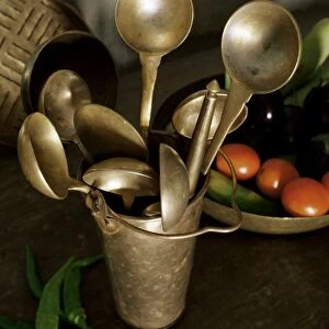Traditional brass kitchen utensils in a home