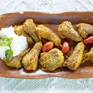 Traditional fried stuffed zucchini flowers with Tzatziki sauce, Crete island, Greek Islands, Greece, Europe