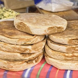 Traditional Madeiran flat bread is cooked and served at a stall in Funchal