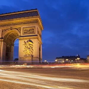Traffic at the Arc de Triomphe at night, Paris, France, Europe