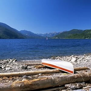 Upturned canoe on the rocky eastern shore of Slocan Lake, New Denver, British Columbia (B