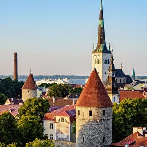View over the Old Town towards St. Olafs Church at sunset, UNESCO World Heritage Site, Tallinn, Estonia, Europe