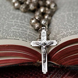 Vintage rosary with crucifix on an open Bible, Christian religious symbol, France, Europe