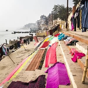 Washing drying on ghats next to the River Ganges, Varanasi, Uttar Pradesh, India, Asia