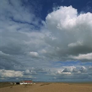 White clouds in a blue sky at Shingle Street near Felixstowe, Suffolk, England