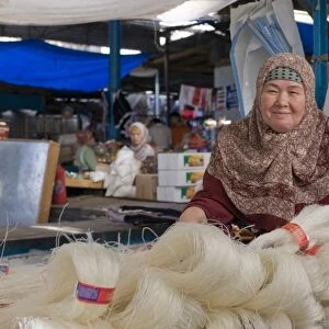 Woman selling rice noodles, Osh, Kyrgyzstan, Central Asia, Asia