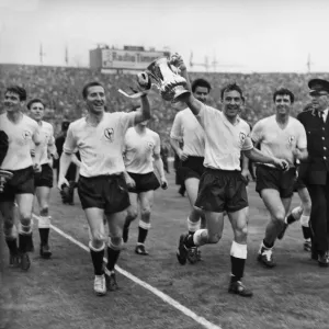 Cliff Jones and Jimmy Greaves parade the FA Cup around Wembley after Spurs victory in 1962